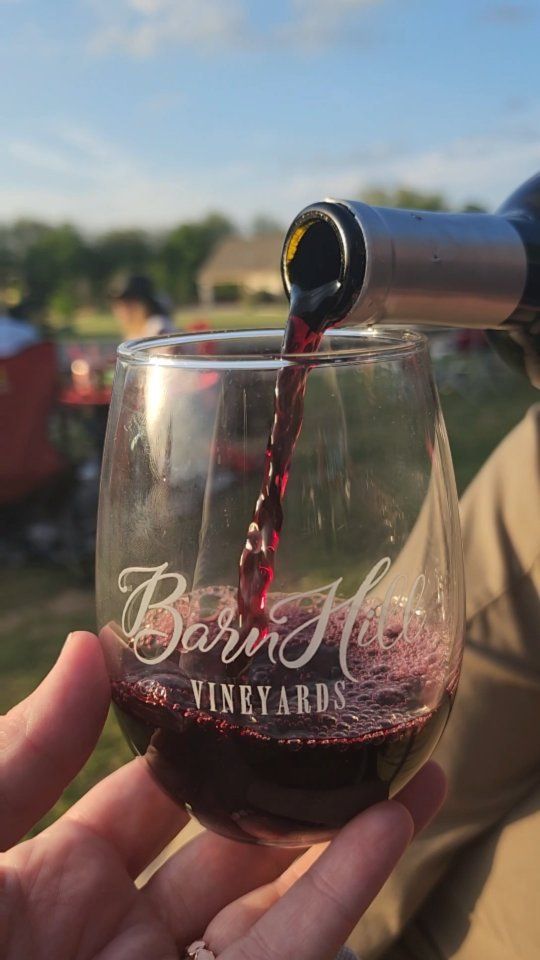 A glass of red on date night at the vineyard